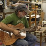 Wayne Henderson playing a Lichty Indian Rosewood OM Guitar with a Curly Redwood top