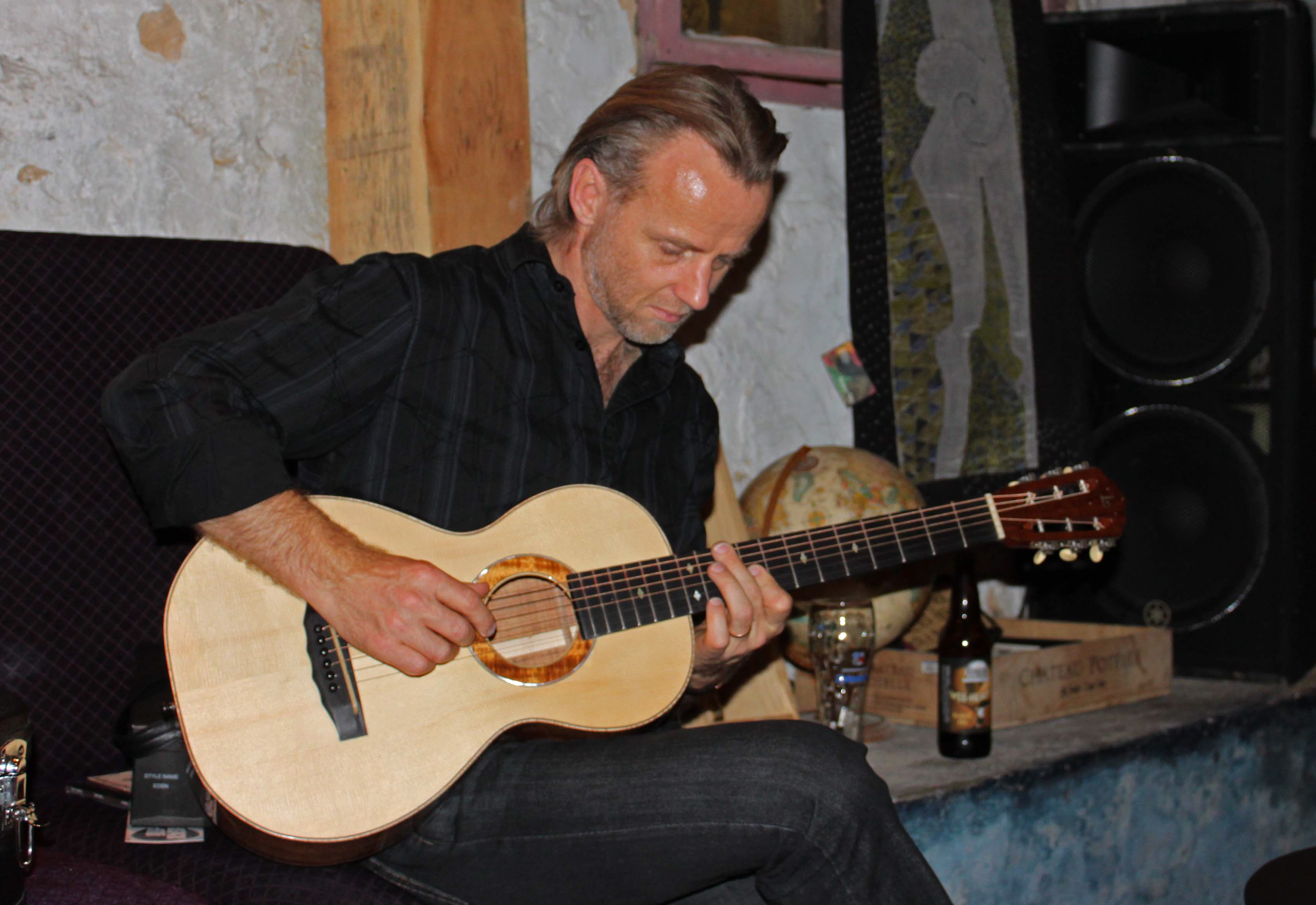 Geoff Achison test-driving a Lichty Koa Parlor Guitar
