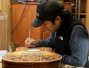 Guitar Artwork being applied by Clark Hipolito